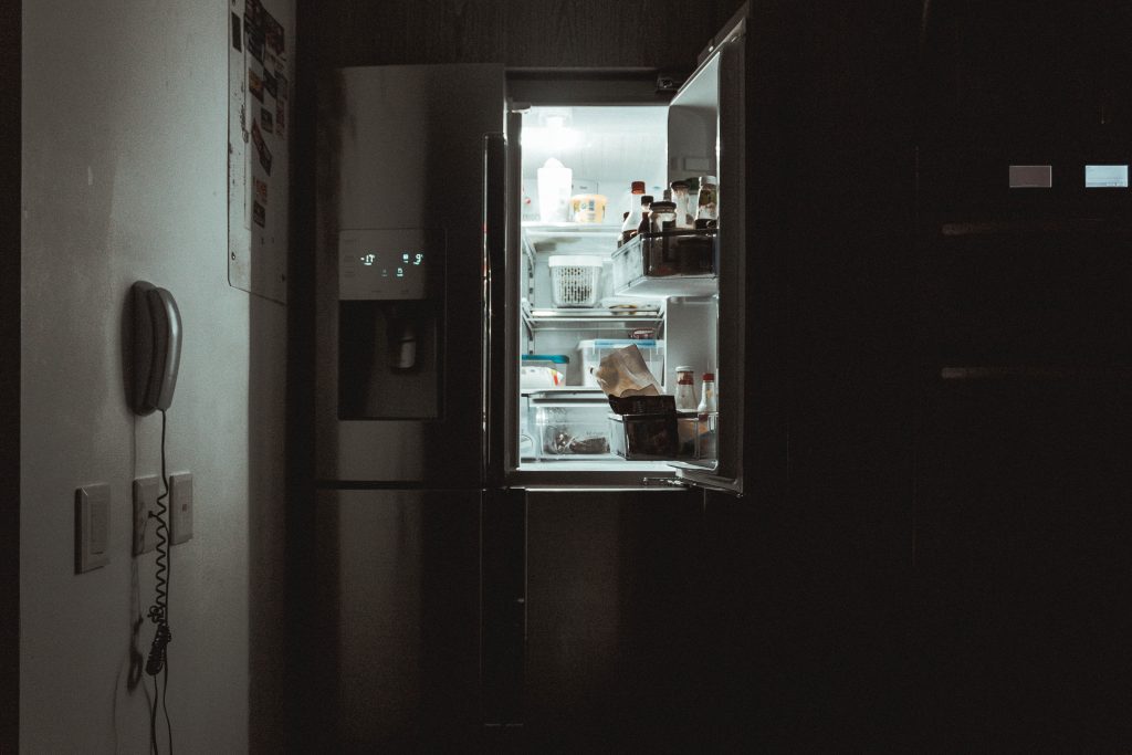 beckoning fridge in the dark